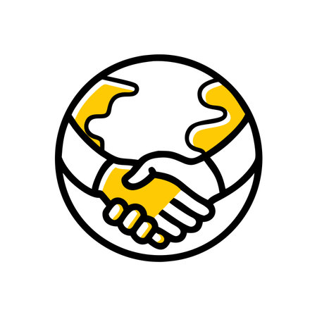 A stylized globe features a handshake in the center, with parts of the continents highlighted in yellowの素材