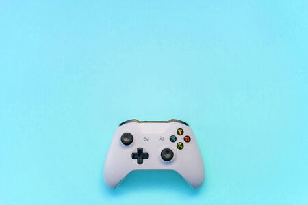 SAINT-PETERSBURG, RUSSIA - APRIL 13, 2018: White joystick xbox one s gamepad, game console on blue...