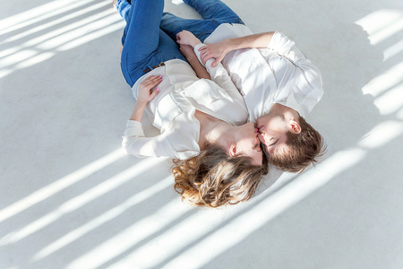 Couple in love having nice time together. Young happy woman hugging boyfriend, white background. Students, bride, groom, engagement, relationship, aspirations, supporting relying concept Bannerの写真素材