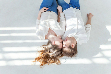 Couple in love having nice time together. Young happy woman hugging boyfriend, white background. Students, bride, groom, engagement, relationship, aspirations, supporting relying concept Bannerの写真素材