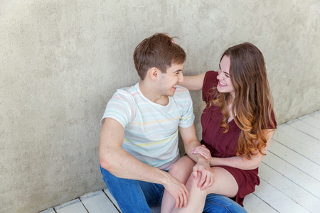 Couple in love having nice time together. Young happy woman hugging boyfriend, white background. Students, bride, groom, engagement, relationship, aspirations, supporting relying concept Bannerの写真素材