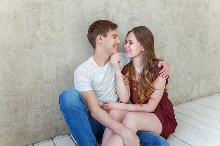 Couple in love having nice time together. Young happy woman hugging boyfriend, white background. Students, bride, groom, engagement, relationship, aspirations, supporting relying concept Bannerの写真素材
