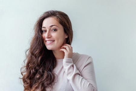 Happy girl smiling. Beauty portrait young happy positive laughing brunette woman on white background isolated. European woman. Positive human emotion facial expression body languageの写真素材
