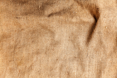 Pastel abstract Hessian or sackcloth burlap woven fabric texture. Wallpaper of artistic wale linen canvas. Blanket or Curtain of cotton pattern background in yellow beige cream sepia brown color. Copy spaceの写真素材