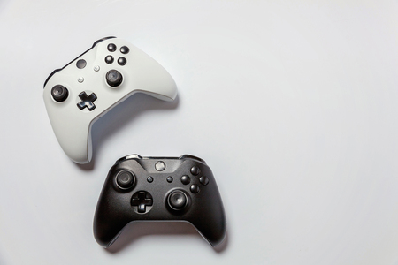 White and black two joystick gamepad, game console isolated on white background. Computer gaming technology play competition videogame control confrontation concept. Cyberspace symbolの写真素材