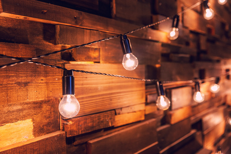 Modern dark classical style interior design apartment with retro lamps hanging light bulbs...