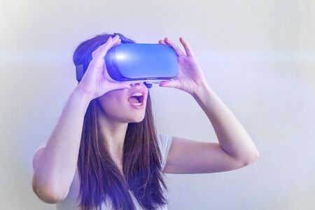Smile happy young woman using the virtual reality headset on white background