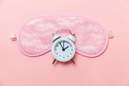 Do not disturb me, let me sleep. Sleeping eye mask, alarm clock isolated on pink pastel colourful...