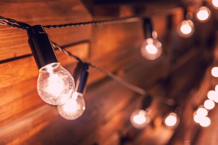 Modern dark classical style interior design apartment with retro lamps hanging light bulbs...