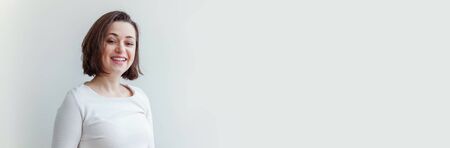 Happy girl smiling. Beauty portrait young happy positive laughing brunette woman on white background...