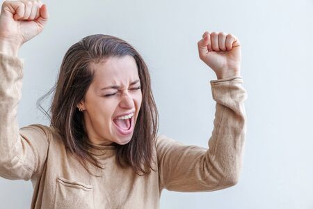 Happy girl smiling. Beauty portrait young happy positive laughing brunette woman on white background isolated. European woman. Positive human emotion facial expression body languageの写真素材