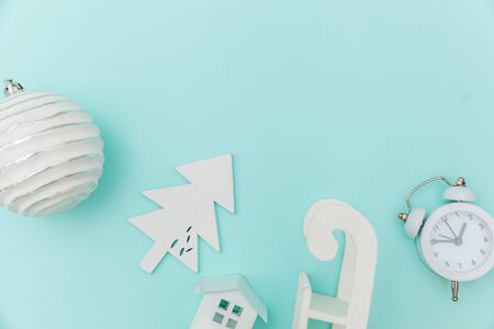 Simply minimal composition winter objects ornament sled fir tree ball gift box isolated blue pastel...