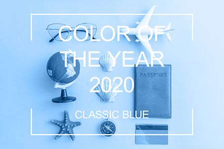 Minimal simple flat lay with plane passport sunglasses globe gold credit card and shell colored in...