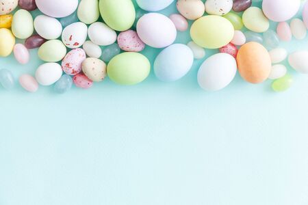 Happy Easter concept. Preparation for holiday. Easter candy chocolate eggs and jellybean sweets...