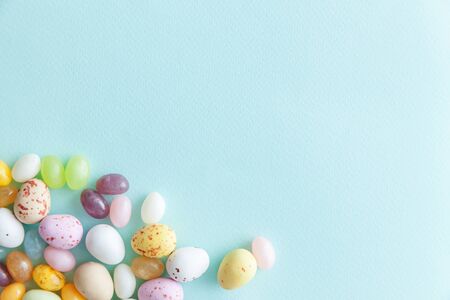 Happy Easter concept. Preparation for holiday. Easter candy chocolate eggs and jellybean sweets...