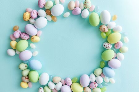 Happy Easter concept. Preparation for holiday. Easter candy chocolate eggs and jellybean sweets...