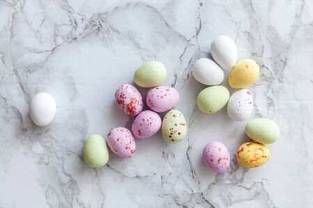 Happy Easter concept. Preparation for holiday. Easter pastel candy chocolate eggs sweets on trendy...