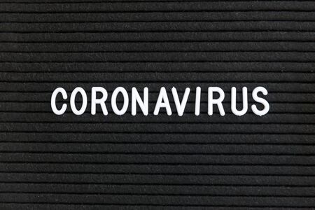 Text phrase Coronavirus on black letter board background. Novel coronavirus 2019-nCoV, MERS-Cov...
