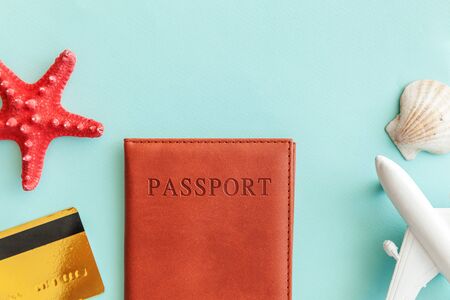 Vacation travel adventure trip concept. Minimal simple flat lay with plane passport gold credit card...