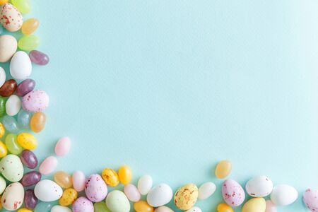 Happy Easter concept. Preparation for holiday. Easter candy chocolate eggs and jellybean sweets...