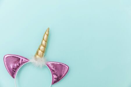 unicorn concept. Simply flat lay design Halloween party accessory unicorn horn hairband isolated on...