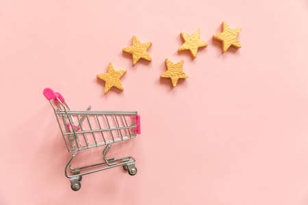 Simply flat lay design small supermarket grocery push cart for shopping and 5 gold stars rating...