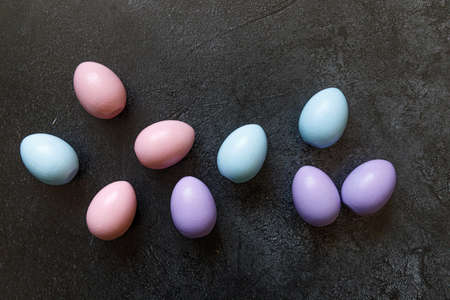 Happy Easter concept. Preparation for holiday. Colorful decorated easter eggs on trendy grunge...