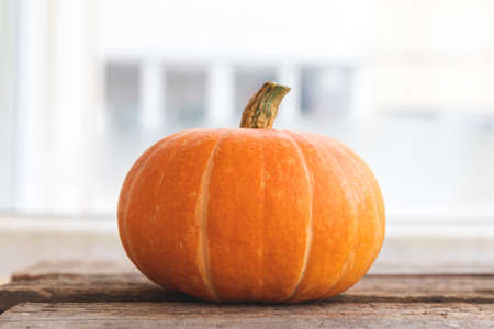 Autumnal Background. Natural autumn fall view pumpkin on wooden background. Inspirational october or...