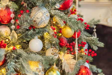 Classic Christmas New Year decorated New year tree with red and white ornament decorations toy and ball. Modern classical style interior design apartment. Christmas eve at homeの写真素材