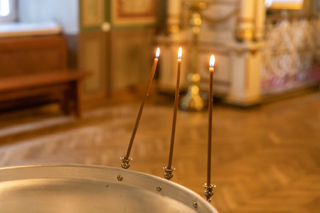 Orthodox Church. Christianity. Festive interior decoration with burning candles and icon in...