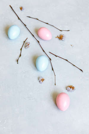 Happy Easter concept. Preparation for holiday. Colorful decorated easter eggs spring branches on...