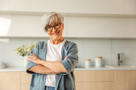 Portrait of confident stylish european middle aged senior woman. Older mature 60s lady smiling at home. Happy attractive senior female looking camera close up face headshot portrait. Happy peopleの写真素材