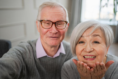 Happy senior woman man talk on video call with friends family. Mature old grandmother grandfather...