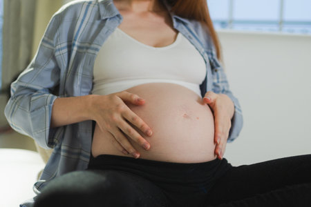Pregnancy motherhood people expectation future. Pregnant woman hands touching big belly. Girl...