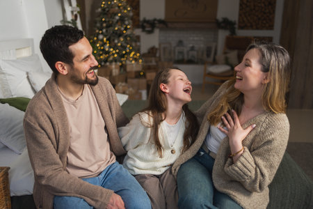 Merry Christmas Xmas. Happy family mother father daughter kid near Christmas tree at home. Parents...