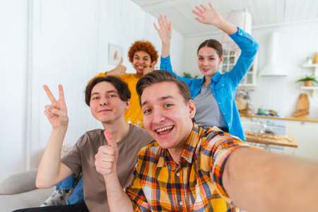 Cheers Funky mood. Happy friends make selfie. Man taking photo of friends at party. Group of...