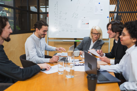 Teamwork brainstorm. Coworkers cooperating working together at office meeting. Colleagues discussing...