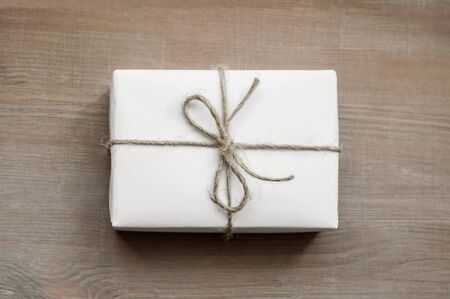 Green glass jar with white tag, fabric cover and natural packthreadの写真素材