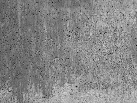Wet white stains on cement wall with textured holes background template imageの写真素材