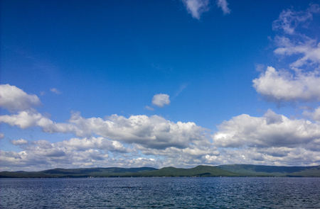 Sea and blue sky. White clouds over lake. Summer Landscapeの写真素材