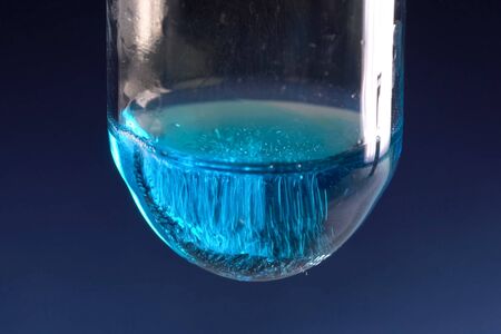 Chemical experiments with chemicals, flasks and mixing chemicals.の写真素材