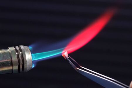 Heating the gas torch pieces of metal. Gas burner fireの写真素材