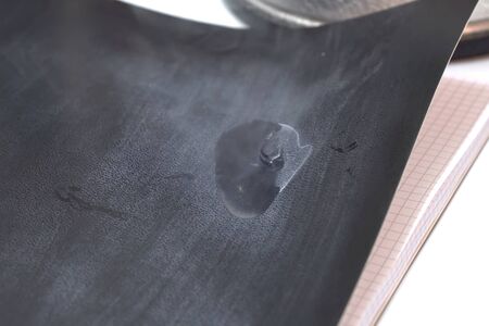 Liquid nitrogen on notebook paper. Liquid nitrogenの写真素材