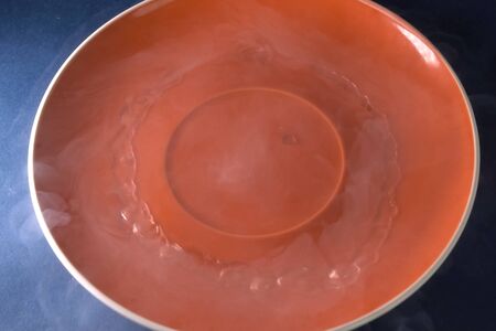 Liquid nitrogen on the plate. Boiling liquid nitrogen.の写真素材