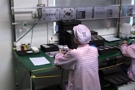 Shenzhen, China - October 20, 2017: Ulefone factory, assembling and quality control of smartphones at the factory of their production.のeditorial素材