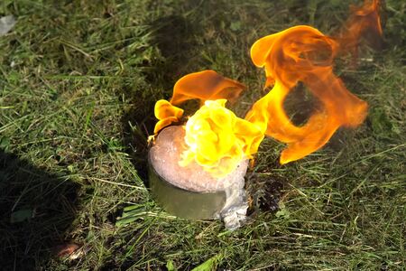 Burning chemical reagent in a can. Chemical experiments.の写真素材
