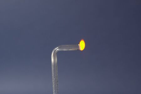 Burning gas coming out of a glass tube, chemical experiments in the laboratory.の写真素材