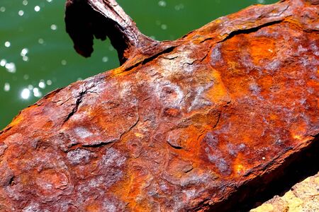 Iron oxide, rusting steel. Peeling of rust