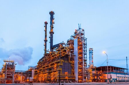 Construction of a petrochemical and oil refinery near the city of Tobolsk in Russia, workers working...