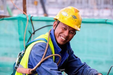 Tobolsk, Russia - June 14, 2018: Worker in a protective helmet and a suit on the zovoda. Worker...